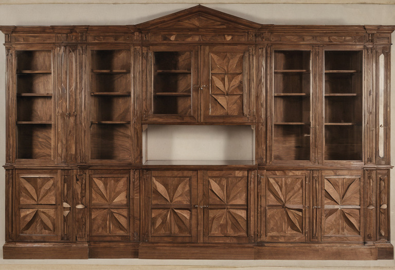 Four veneer leaves arranged across a cabinet elevation for sequence matching