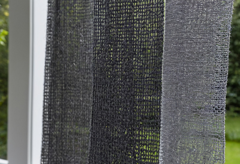 Close view of two solar-screen weaves with different openness factors
