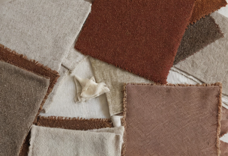Four upholstery swatches prepared for concealed cleaning tests