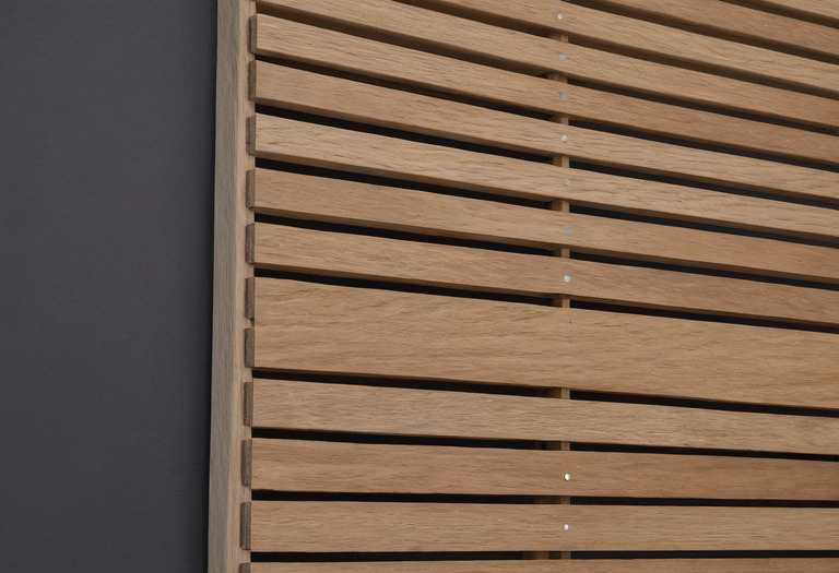 Cutaway assembly of timber slats over acoustic fiber and an air cavity