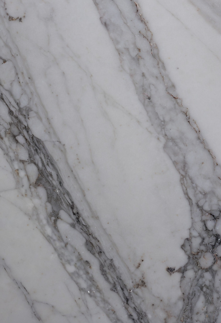 Marble sample showing a dull acid etch beside a darker absorbed stain